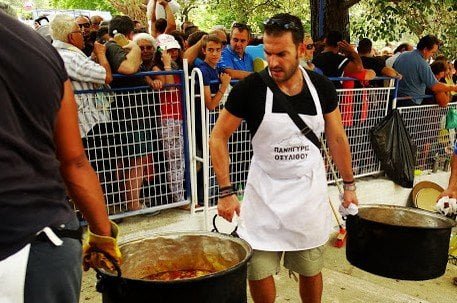 Euboea, Oxilithos Festival - Gastronomy Tours men carrying bronze cauldrons with food at Oxilithos Festival, Euboea, Greece