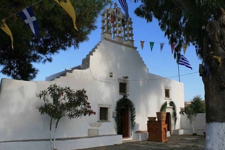 Paros, Marmara, Festival of Pera Panagia - Gastronomy Tours front of the church Pera Panagia commemorate festival of them at Paros, Marmara, Greece surrounded by trees