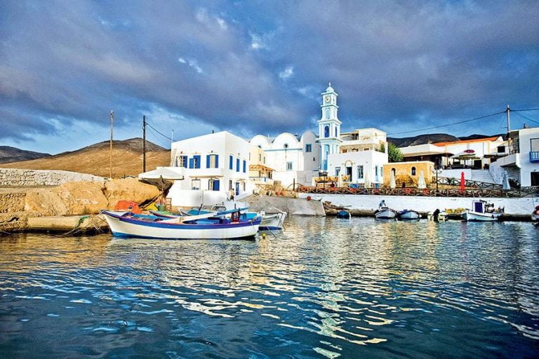 seaport of Kasos with small boaths and a church