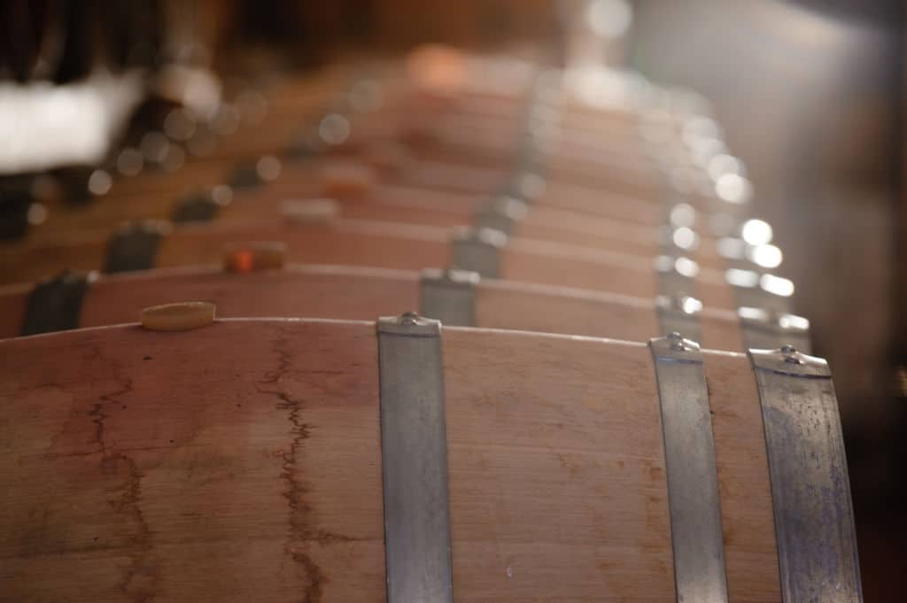 Tsililis Awards - Gastronomy Tours lying wooden barrels in a row at ‘Tsililis’ cellar that recognized with many awards|