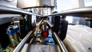 Close-up of a view of bottle at beer packaging machine at Elis Brewery plant