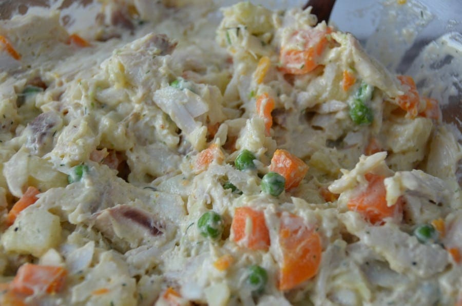 Athenian Salad Fish Mayonnaise - Gastronomy Tours Close-up of Greek ‘Athenian salad fish mayonnaise’ with boiled fish, herbs, carrots and potatoes, capers, pickled gherkins and mayonnaise