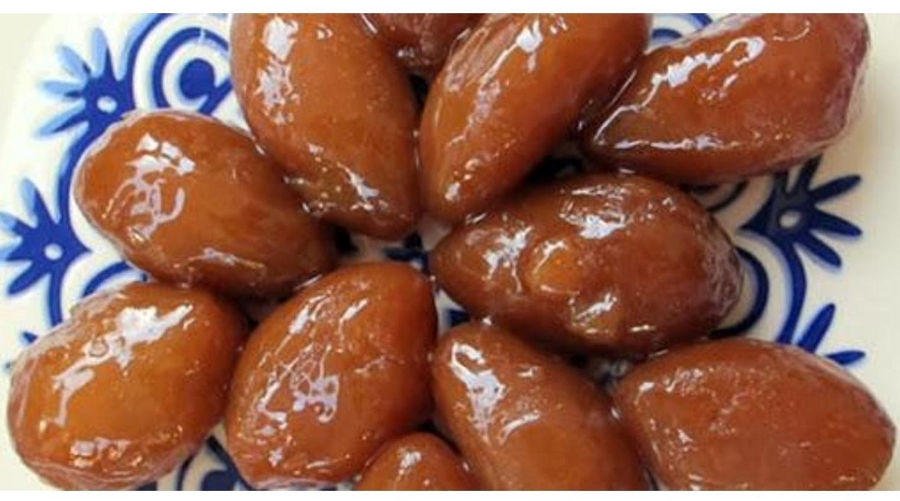 Finikia - Gastronomy Tours Close-up of Greek ‘Finikia’ are brown spherical cookies covered with honey