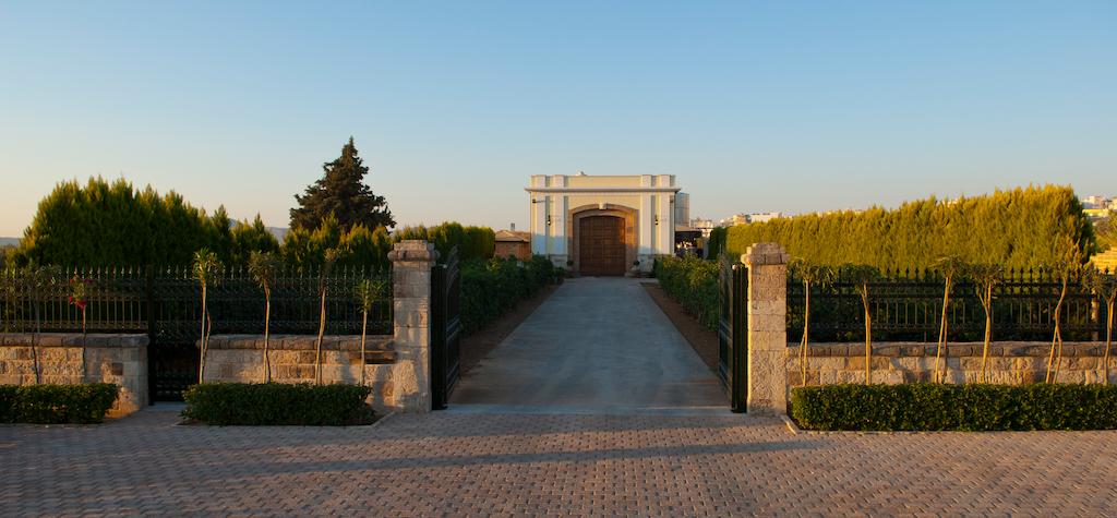 Newsletter - December 2022 - Gastronomy Tours Front view oh building and has lawn green, fence and stone walkway