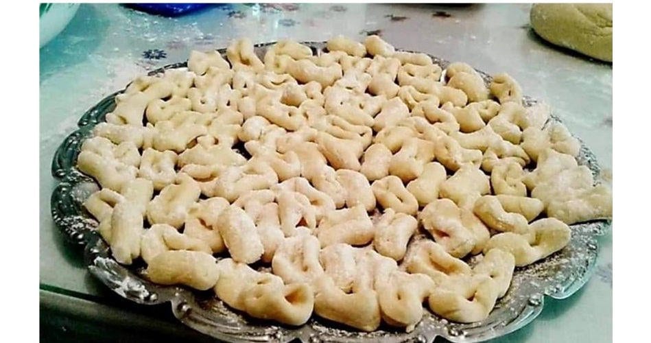 Goglies - Gastronomy Tours Close-up of plateau with uncooked Greek ‘Goglies’ is a fresh pasta like tortellini