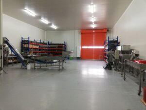 Inside the olive oil press, machinery hums with purpose, a symphony of gears and pulleys, where ancient tradition meets modern technology to transform olives into liquid gold.