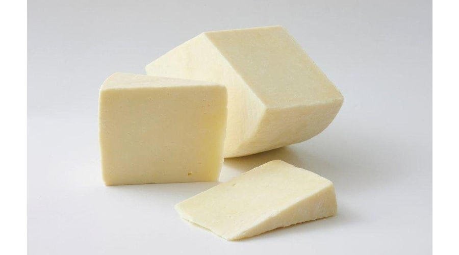 Kaseri - Gastronomy Tours close-up of pieces of Greek ‘Kaseri’ is synonymous with yellow cheese
