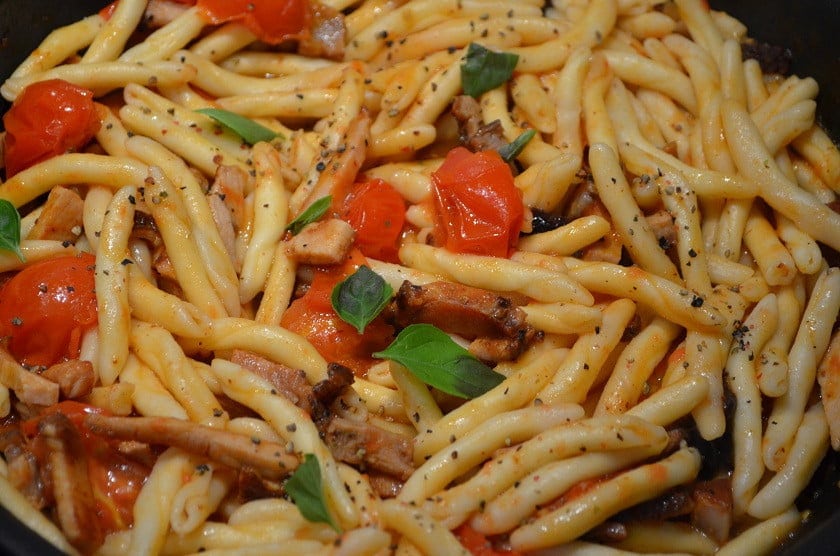 Makarouni - Gastronomy Tours Close-up of Greek ‘Makarouni skioufichta’ food like Gemelli pasta cooked with tomatoes sauce