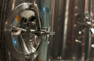 wine fermentation tank's door at Esti Wines facilities