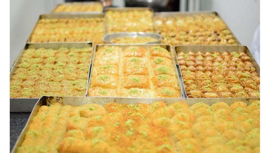 Baking pans with ‘siropiasta’ are to sweets made with thin leaves of pastry and dried nuts over which