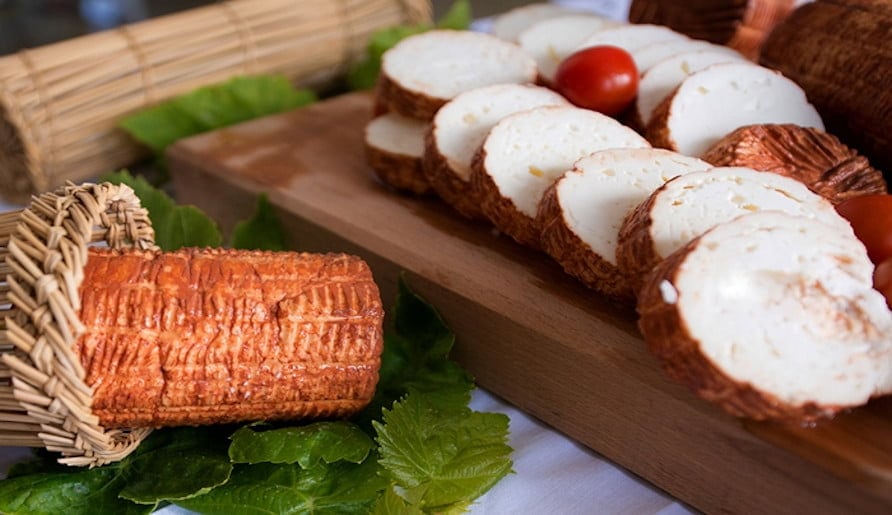 Possa - Gastronomy Tours Close-up of round pieces of Greek ‘Possa’ a white cheese covered with brown