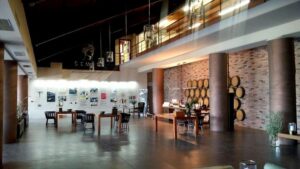 Semeli Estate reception with leather crouches and a spherical fireplace in the center