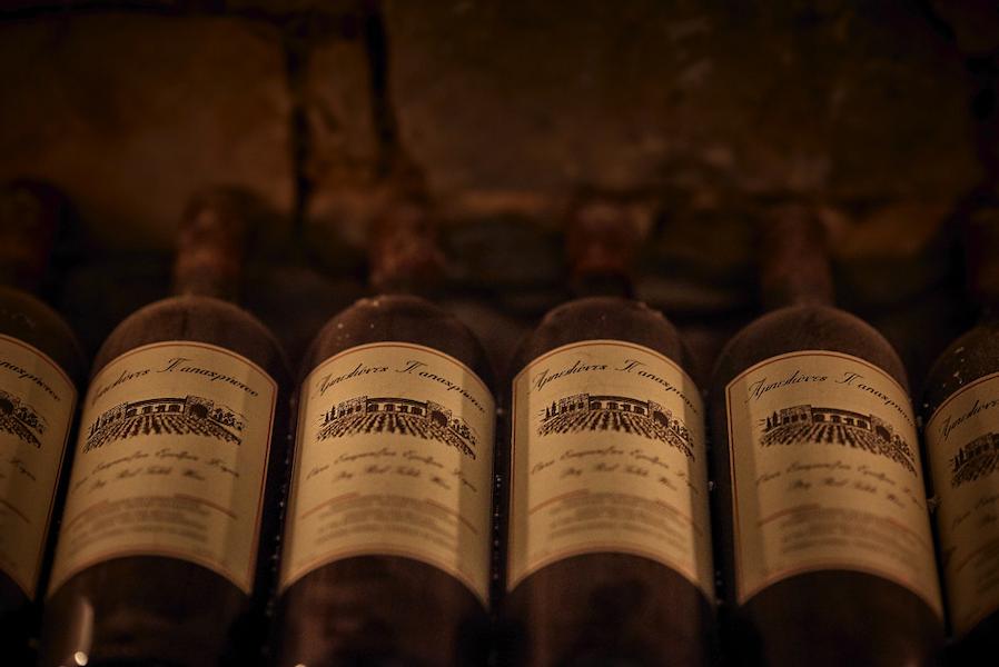 Κellari Papachristou Awards - Gastronomy Tours aged wine bottles at kellari Papachristou|