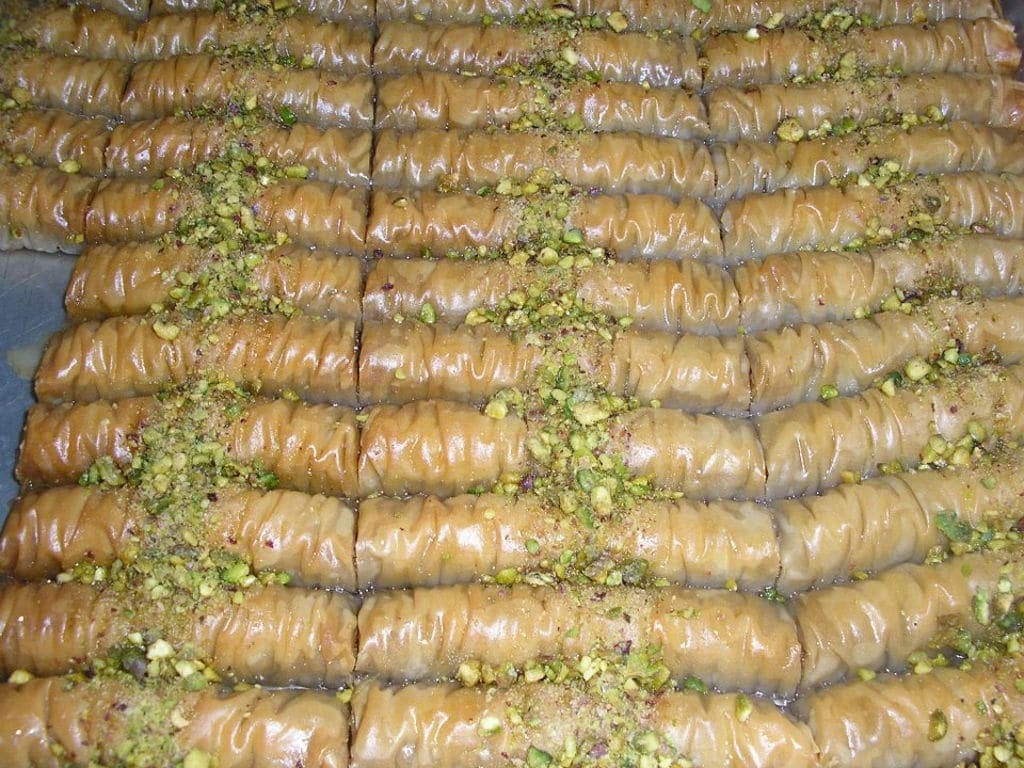 Agrotouristic Women’s Cooperative of Mesotopos Lesbos Awards - Gastronomy Tours bakery pans with sweets in syrup ‘Agrotouristic Women’s Cooperative of Mesotopos Lesvos’ that recognized with many awards|