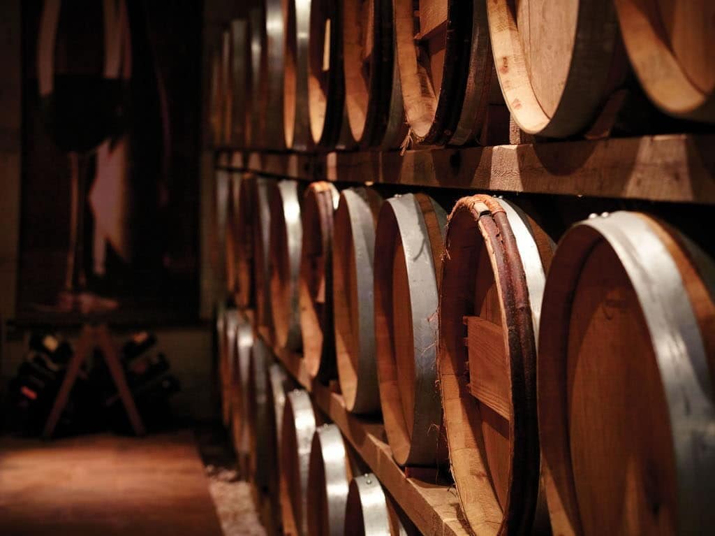Avantis Estate Awards - Gastronomy Tours wooden barrels on top of each other at ‘Avantis Estate’ cellar that recognized with many awards|