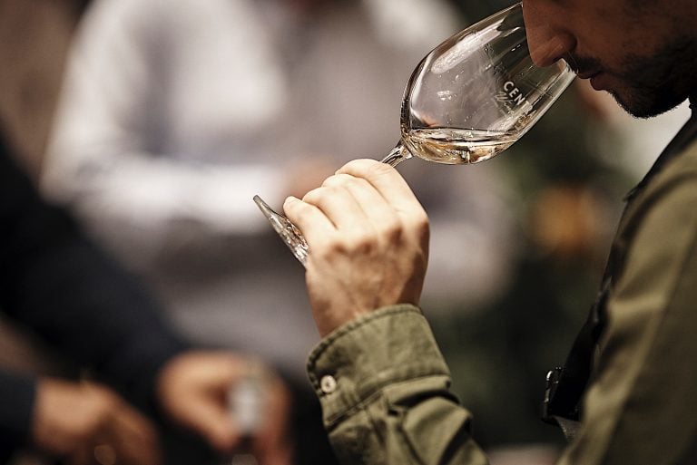 Central Wine Fair - Gastronomy Tours Close-up of a man tasting wine at central wine fair|