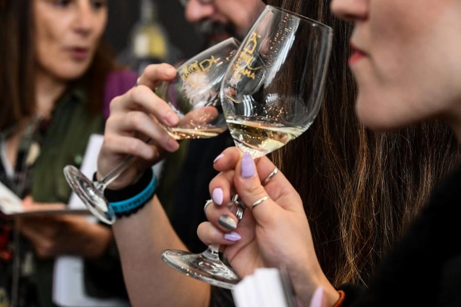 Thessaly Wine Festival - Gastronomy Tours Close-up of a couple tasting white wine
