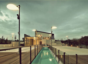 view of illuminated Domaine Papagiannakos winery by night, the building, the piscine