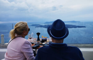 Two souls indulging in wine, mesmerized by the view. A sensory journey blending flavors, love, and breathtaking beauty.