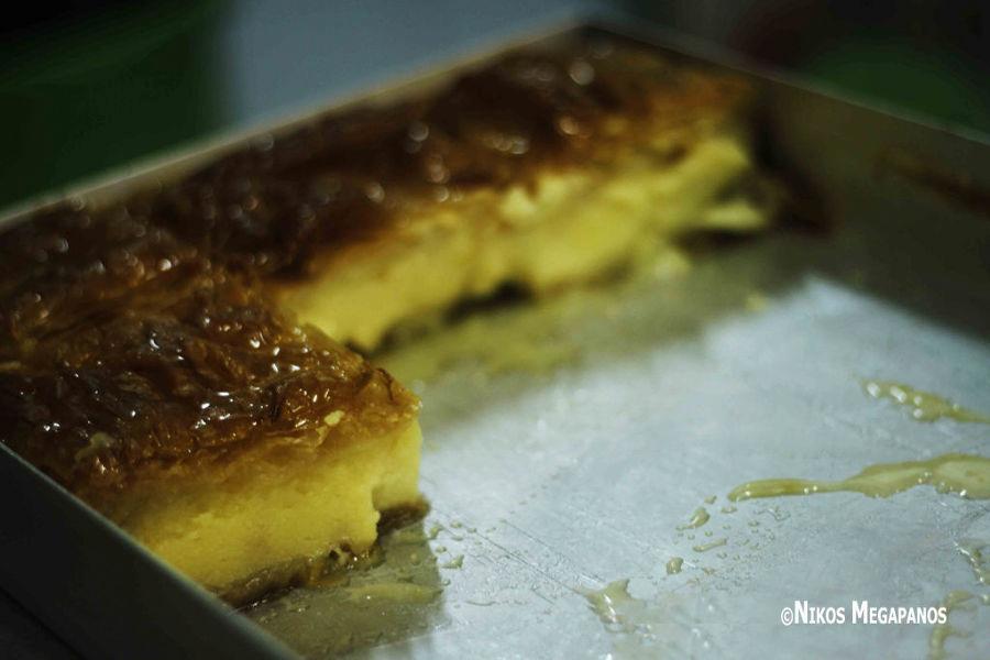 Galaktoboureko - Gastronomy Tours Close-up of pieces of Greek ‘Galaktoboureko’ is sweet made of semolina custard in filo dough covered with syrup