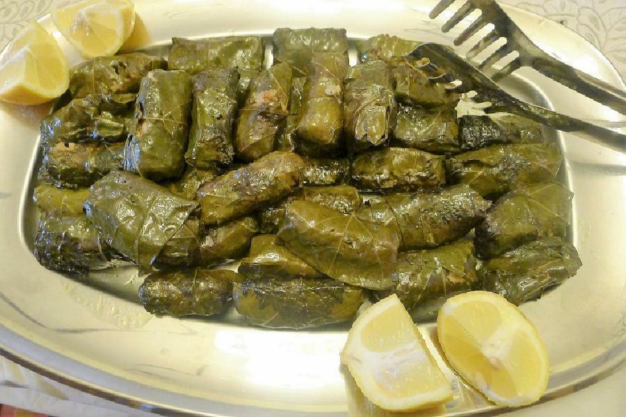 Giaprakia - Gastronomy Tours Close-up of Greek ‘Giaprakia’ means cooked stuffed vine leaves|