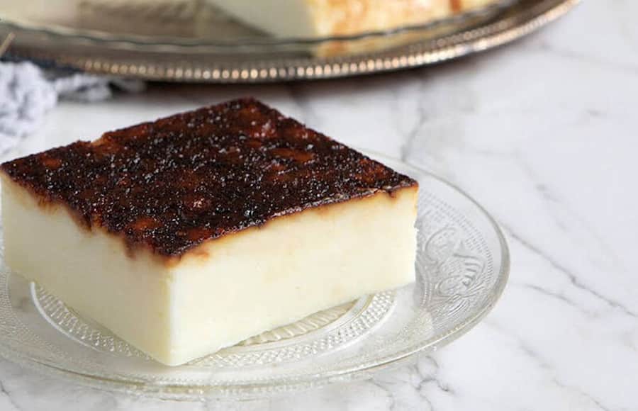 Kazandibi - Gastronomy Tours plate with a piece of 'kazan dipi' sweet wich is milk pudding and caramel sauce on the top