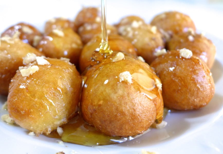 Loukoumades - Gastronomy Tours Close-up of Greek ‘Loukoumades’ are made from dollops of doughy batter fried in oil and covered with honey