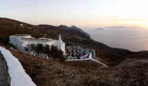 view of 'Manalis Winery' in the background of blue sky and the sea