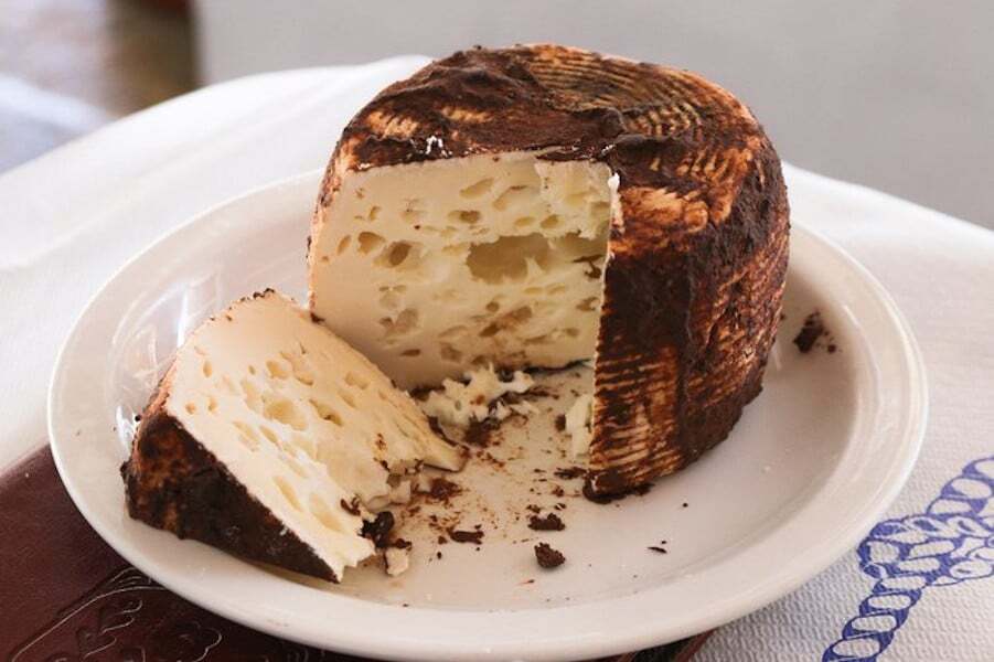 Close-up of round Greek &lsquo;Manoura&rsquo; yellow cheese 