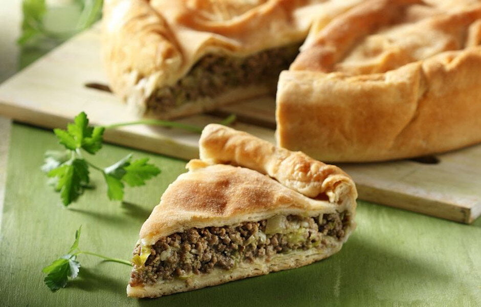 Pita - Gastronomy Tours Greek ‘pita’ using pastry crust or filo baked in the oven filling with spinach||pita with souvlaki on wooden surface