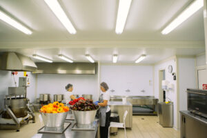 two women cleaning the peppercorns at 'Rizes Greek Delicatessen' plant
