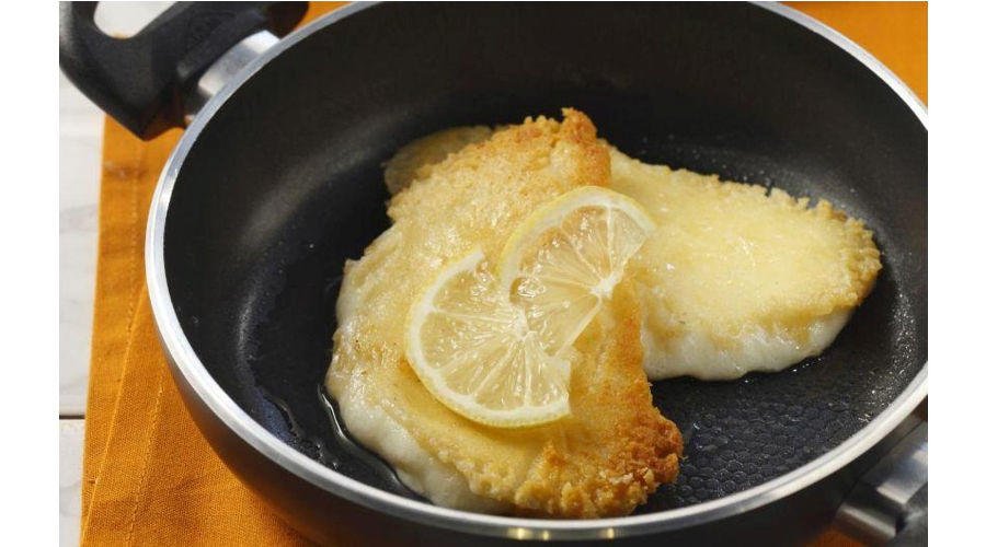 Saganaki - Gastronomy Tours Cooked Greek ‘Saganaki’ means fried cheese in a small pan with two handles and slices of lemon on top||Cooked Greek Saganaki means fried shrimps with white cheese in a small pan with two handles