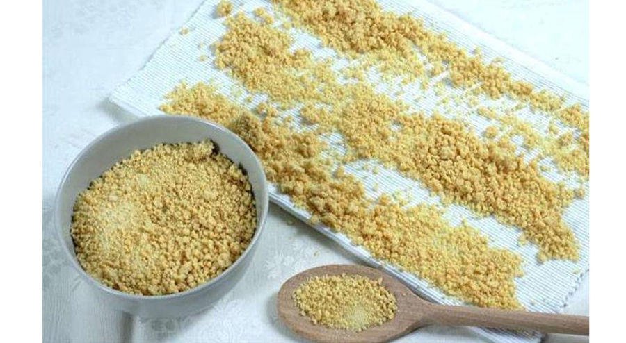 Trahanas - Gastronomy Tours Bowl and spoon with ‘trahana’ pasta has a granular and irregular shape|