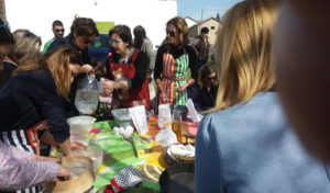 woman teaching cooking lessons to tourists at 'The Trinity Farm'