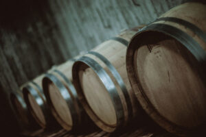 lying wine wooden barrels in a row at Pantou winery