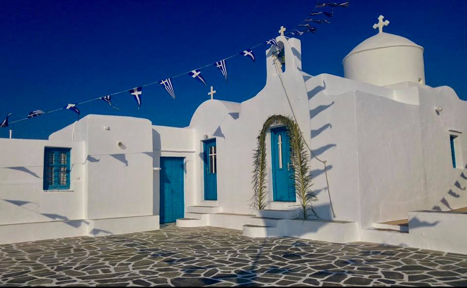 The Traditional Festival of the Holy Cross in Faros, Sifnos - Gastronomy Tours Whitewashed building with blue accents
