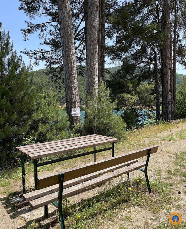 Lake Doxa - Walk in the Alps of Corinthia by George, our Gastronomic correspondent from “Taste Local Greece” - Gastronomy Tours Bench with a table 1 - Gastronomy Tours