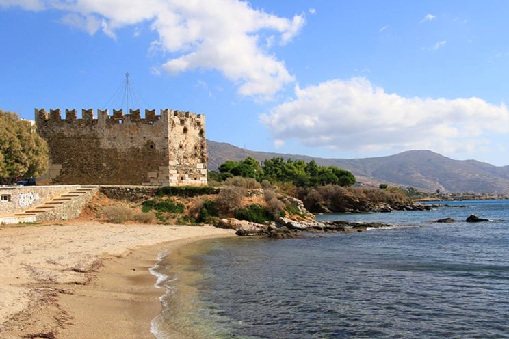 The Best Karystos Food Tours - Gastronomy Tours a stone building on a beach