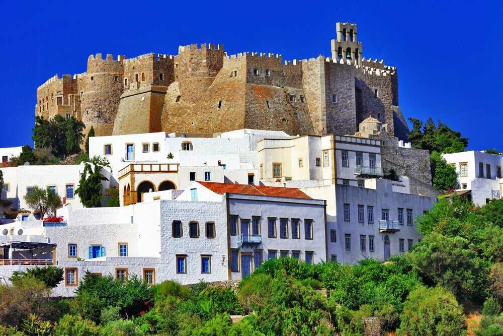 The Best Patmos Food Tours - Gastronomy Tours a castle on top of a hill in Patmos
