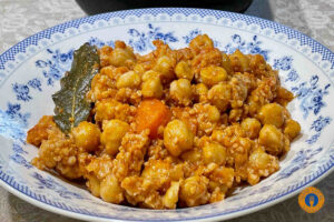 Chickpeas in Tomato Sauce with xinohondros and cumin - Gastronomy Tours Chickpeas in Tomato Sauce
