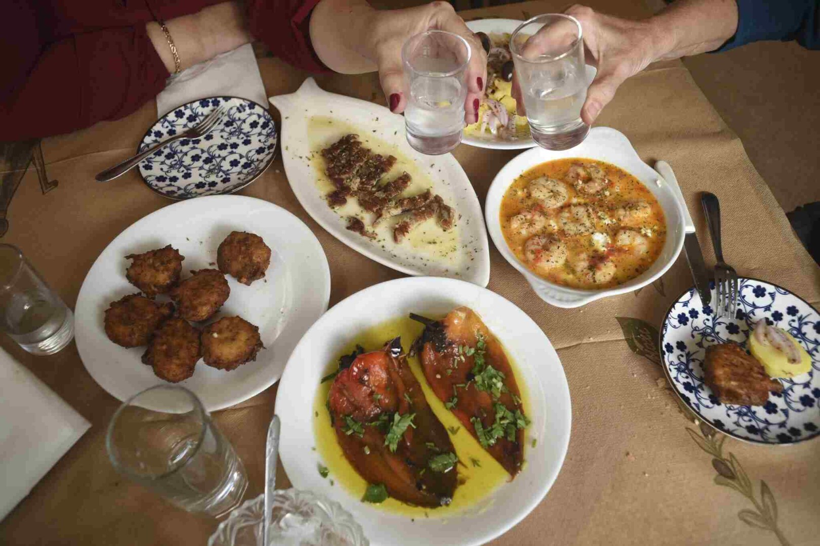 Meze - Gastronomy Tours a table with plates of food and glasses